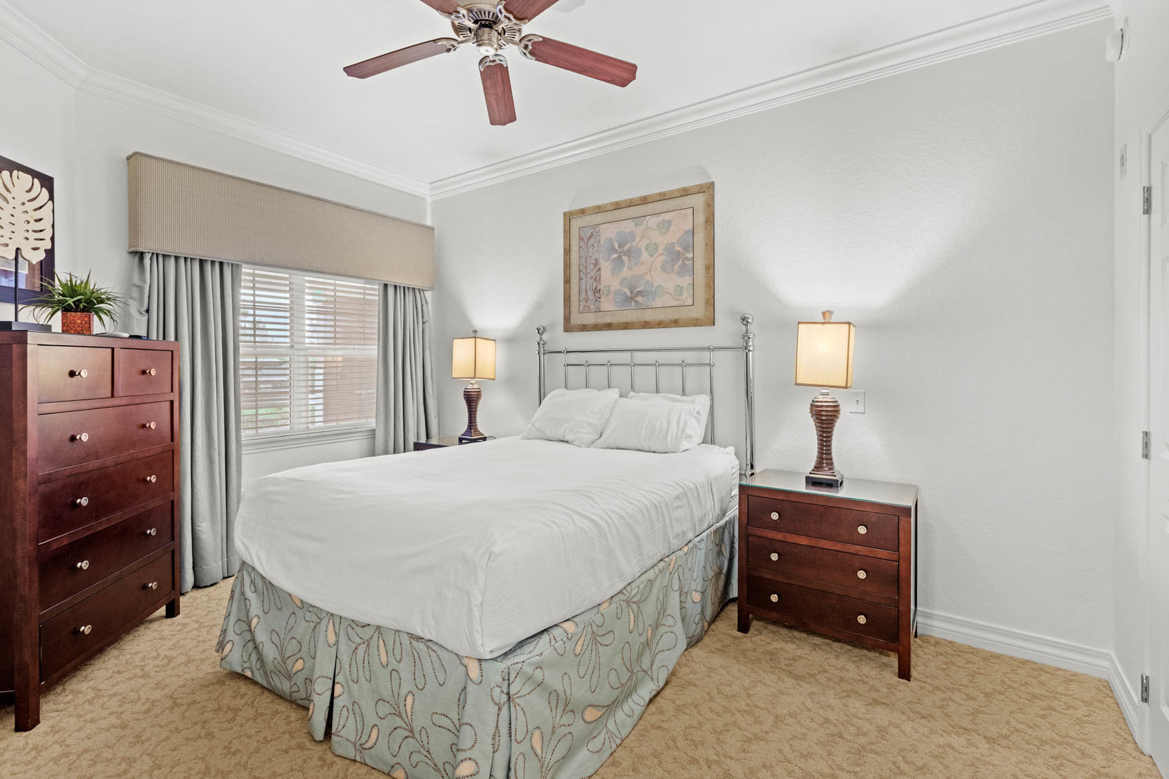 bedroom with full size bed and white comforter